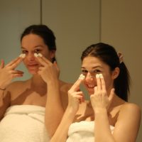 Girls clean their faces